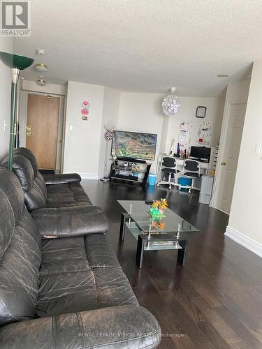 713 - 1700 Eglinton Avenue E, Toronto, ON - Indoor Photo Showing Living Room With Fireplace