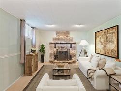 Virtually staged basement family room - 