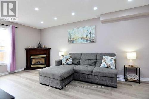 6 - 800 Paramount Drive, Hamilton, ON - Indoor Photo Showing Living Room With Fireplace