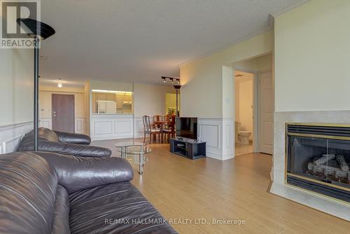 1507 - 168 Bonis Avenue, Toronto, ON - Indoor Photo Showing Living Room With Fireplace