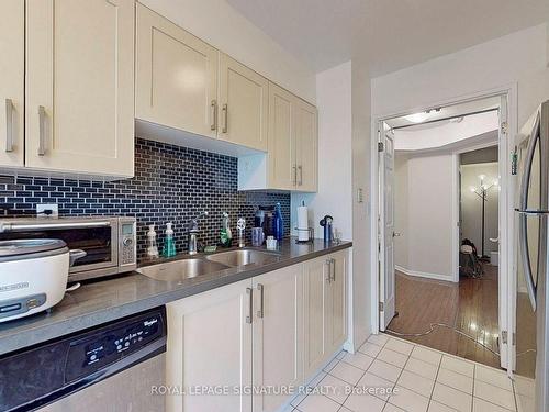 1415-7 Carlton St, Toronto, ON - Indoor Photo Showing Kitchen With Double Sink