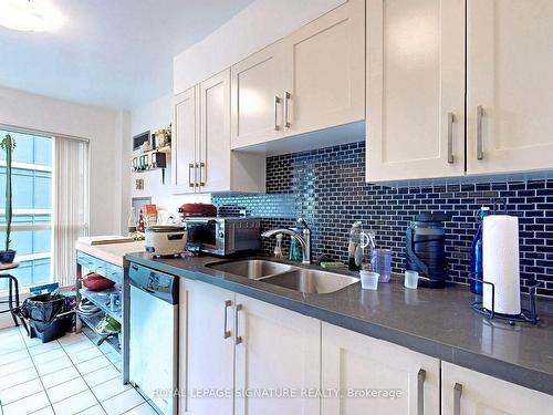 1415-7 Carlton St, Toronto, ON - Indoor Photo Showing Kitchen With Double Sink