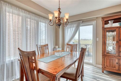 DINING SPACE WITH BRIGHT WINDOWS - 87 Periwinkle Drive, Hamilton, ON - Indoor Photo Showing Dining Room