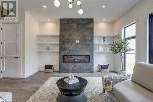 3964 Big Leaf Trail, London, ON - Indoor Photo Showing Living Room With Fireplace