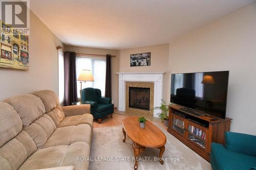 20 - 10 Huntingwood Avenue, Hamilton, ON - Indoor Photo Showing Living Room With Fireplace