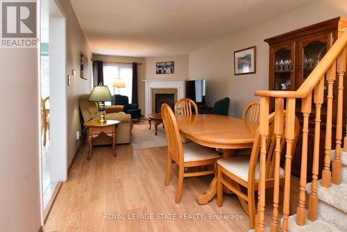 20 - 10 Huntingwood Avenue, Hamilton, ON - Indoor Photo Showing Dining Room With Fireplace