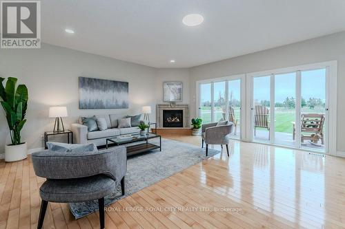 7175 Ariss Valley Road, Guelph/Eramosa, ON - Indoor Photo Showing Living Room With Fireplace