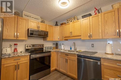 202 2781 Woodbridge Drive, Prince Albert, SK - Indoor Photo Showing Kitchen With Stainless Steel Kitchen