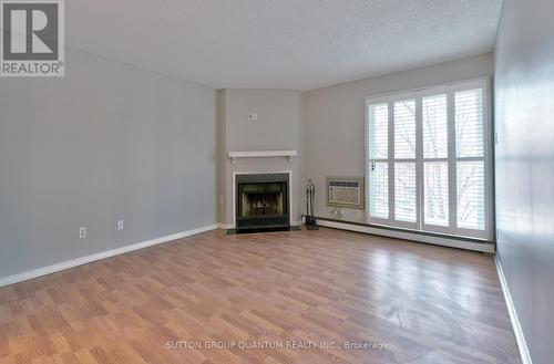 531 - 1514 Pilgrims Way, Oakville, ON - Indoor Photo Showing Living Room With Fireplace