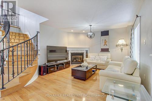 64 Metcalfe Drive, Bradford West Gwillimbury, ON - Indoor Photo Showing Living Room With Fireplace