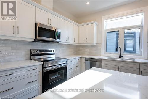 6 - 63 Compass Trail, Central Elgin, ON - Indoor Photo Showing Kitchen With Double Sink With Upgraded Kitchen