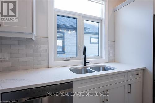6 - 63 Compass Trail, Central Elgin, ON - Indoor Photo Showing Kitchen With Double Sink