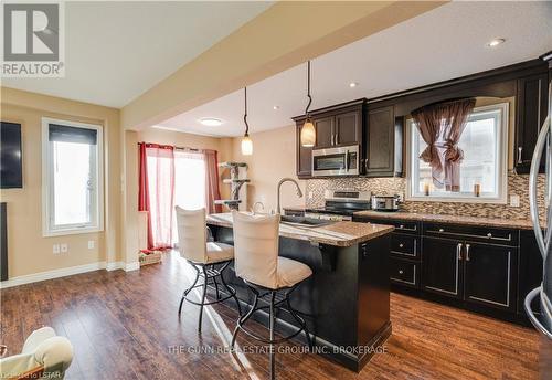 6861 Vallas Circle, London, ON - Indoor Photo Showing Kitchen With Fireplace