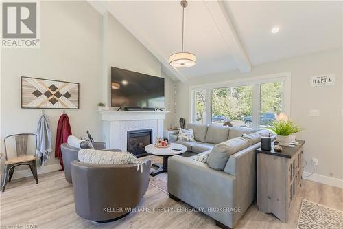 21 Chiniquy Street, Bluewater, ON - Indoor Photo Showing Living Room With Fireplace