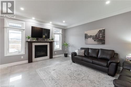 107 Thames Springs Crescent, Zorra, ON - Indoor Photo Showing Living Room With Fireplace