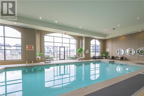 404 - 240 Villagewalk Boulevard, London, ON - Indoor Photo Showing Other Room With In Ground Pool