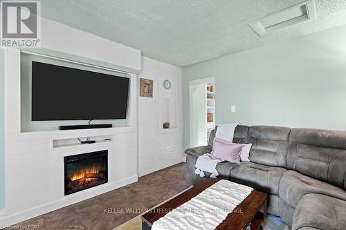 104 Main Street, Southwest Middlesex, ON - Indoor Photo Showing Living Room With Fireplace