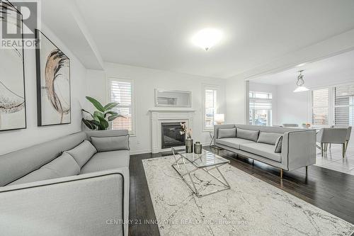 95 Bridlewood Boulevard, Whitby, ON - Indoor Photo Showing Living Room With Fireplace