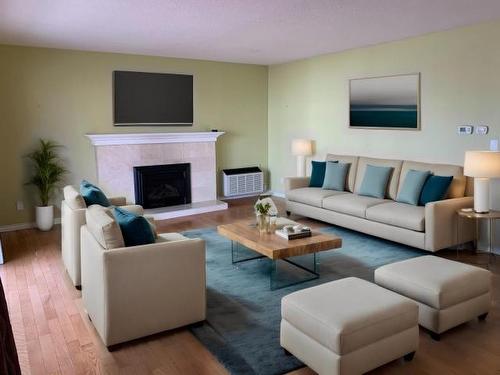 310-411 Nicola Street, Kamloops, BC - Indoor Photo Showing Living Room With Fireplace