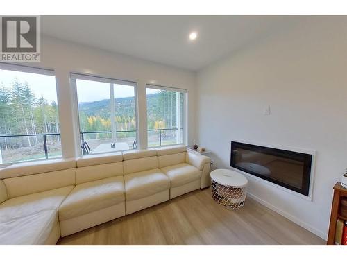 5090 50A Street Ne, Salmon Arm, BC - Indoor Photo Showing Living Room With Fireplace