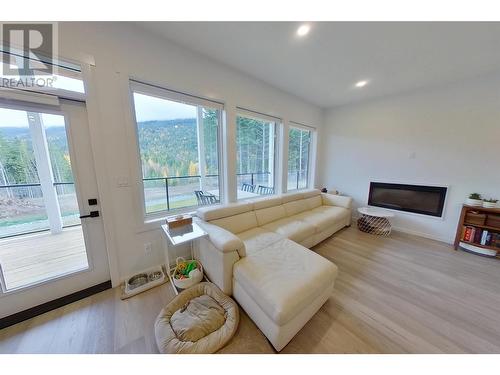 5090 50A Street Ne, Salmon Arm, BC - Indoor Photo Showing Living Room With Fireplace