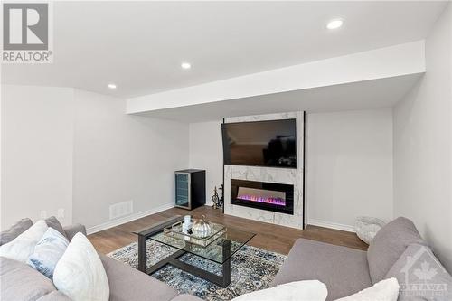 165 Angelonia Crescent, Gloucester, ON - Indoor Photo Showing Living Room With Fireplace
