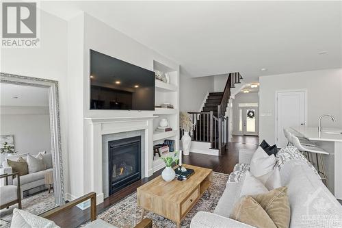 165 Angelonia Crescent, Gloucester, ON - Indoor Photo Showing Living Room With Fireplace