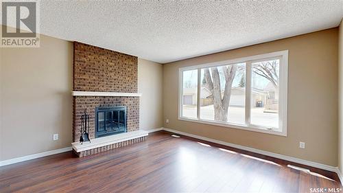 3 Markwell Drive, Regina, SK - Indoor Photo Showing Living Room With Fireplace