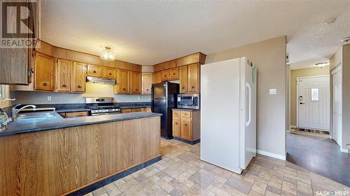 3 Markwell Drive, Regina, SK - Indoor Photo Showing Kitchen With Double Sink
