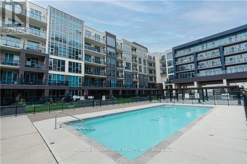 609 - 16 Concord Place, Grimsby, ON - Outdoor With In Ground Pool With Balcony With Facade