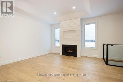 2 - 108 Coastal Crescent, Lambton Shores, ON - Indoor Photo Showing Living Room With Fireplace