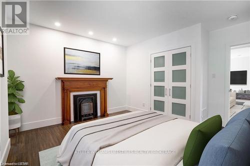 3 - 130 Windsor Crescent, London, ON - Indoor Photo Showing Bedroom With Fireplace