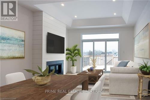 1 - 110 Coastal Crescent, Lambton Shores (Grand Bend), ON - Indoor Photo Showing Living Room With Fireplace