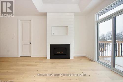 1 - 110 Coastal Crescent, Lambton Shores (Grand Bend), ON - Indoor Photo Showing Living Room With Fireplace