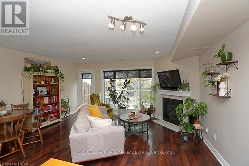 11 - 40 Ontario Street S, Lambton Shores, ON - Indoor Photo Showing Living Room With Fireplace