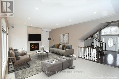 22 Mcintosh Court, London, ON - Indoor Photo Showing Living Room With Fireplace
