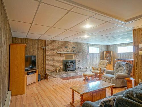 Family room - 150 Rue Riendeau, Coaticook, QC - Indoor With Fireplace