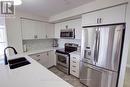 609 - 1940 Ironstone Drive, Burlington, ON  - Indoor Photo Showing Kitchen With Double Sink With Upgraded Kitchen 