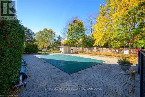 301 - 1237 North Shore Boulevard E, Burlington, ON - Outdoor With In Ground Pool With Backyard
