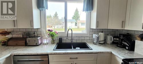 13 Evans Place, Meadow Lake, SK - Indoor Photo Showing Kitchen With Double Sink