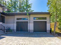 Double car garage with high ceilings and door to backyard - 