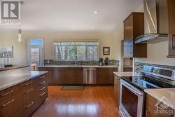Kitchen with large windows and plenty of countertop space - 
