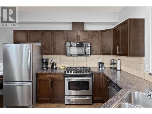 1128 Sunset Drive Unit# 401, Kelowna, BC - Indoor Photo Showing Kitchen With Stainless Steel Kitchen With Double Sink