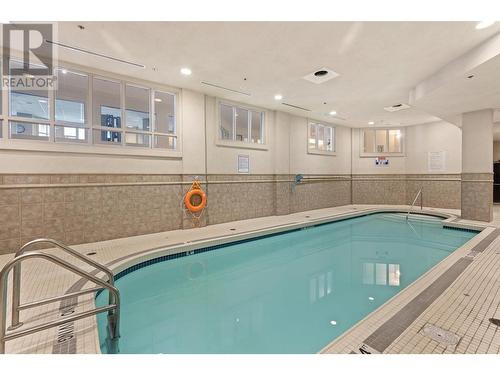 1128 Sunset Drive Unit# 401, Kelowna, BC - Indoor Photo Showing Other Room With In Ground Pool