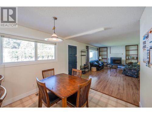 13415 Cartwright Avenue, Summerland, BC - Indoor Photo Showing Dining Room With Fireplace