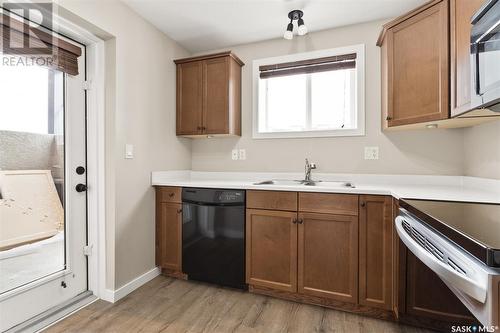 12 4640 Harbour Landing Drive, Regina, SK - Indoor Photo Showing Kitchen With Double Sink