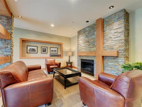 404-1375 Bear Mountain Pkwy, Langford, BC - Indoor Photo Showing Living Room With Fireplace