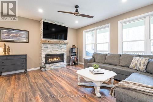 1091 Chemin Du Loup Road, Tiny, ON - Indoor Photo Showing Living Room With Fireplace