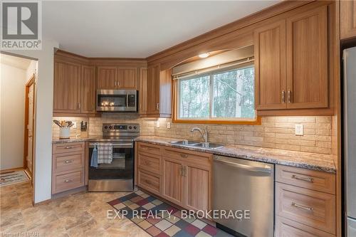 10288 Riverside Drive, Lambton Shores (Grand Bend), ON - Indoor Photo Showing Kitchen With Double Sink