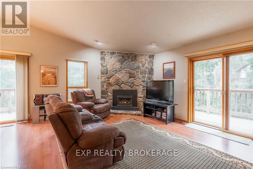 10288 Riverside Drive, Lambton Shores (Grand Bend), ON - Indoor Photo Showing Living Room With Fireplace